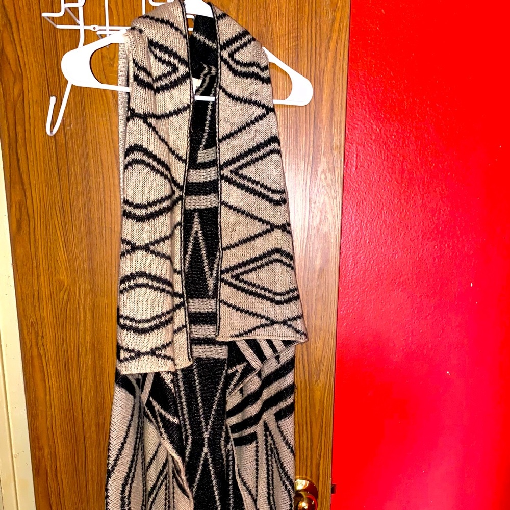 Long sweater vest.